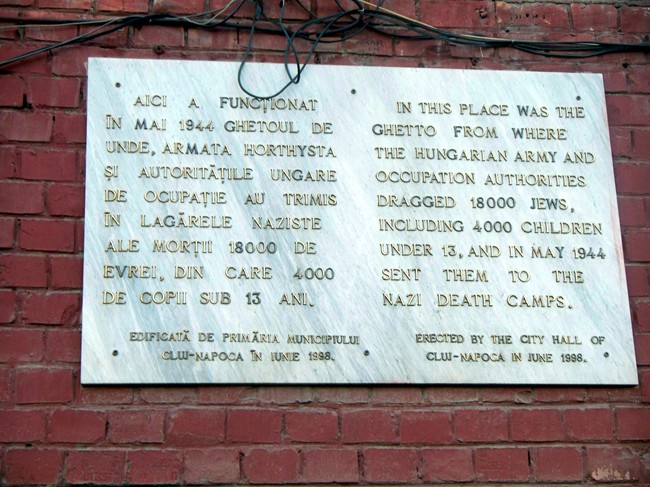 The plague on its wall, right above our bus stop